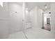 Modern bathroom featuring marble-style tile, stand-up shower, and white vanity at 197 Rotonda Cir, Rotonda West, FL 33947