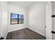 Cozy bedroom featuring modern wood floors, a window for natural light, and fresh, neutral paint at 197 Rotonda Cir, Rotonda West, FL 33947