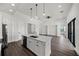 Modern kitchen with a large island and stainless steel appliances at 197 Rotonda Cir, Rotonda West, FL 33947