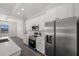 Kitchen with a large stainless steel refrigerator and plenty of cabinet space at 197 Rotonda Cir, Rotonda West, FL 33947