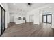 Open-concept floor plan featuring a kitchen with stainless steel appliances and a large living area at 197 Rotonda Cir, Rotonda West, FL 33947