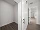 Spacious walk-in closet with wood floors and custom shelving for optimal storage and organization at 197 Rotonda Cir, Rotonda West, FL 33947