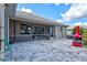 A beautiful outdoor space with a screened lanai and a brick paved patio area perfect for outdoor entertaining at 22324 Wexford Blvd, Venice, FL 34293