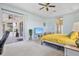 Spacious main bedroom with natural light, a view to the lanai, and comfortable seating at 22324 Wexford Blvd, Venice, FL 34293