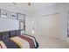Bright bedroom featuring neutral carpet, a ceiling fan, and stylish furnishings at 22324 Wexford Blvd, Venice, FL 34293