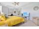 Bedroom with a bed, ceiling fan, view to the lanai, and a tray ceiling at 22324 Wexford Blvd, Venice, FL 34293