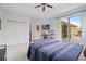 Spacious bedroom with closet, desk, and sliding glass door to patio at 22324 Wexford Blvd, Venice, FL 34293