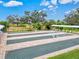 Overhead shot of outdoor bocce courts bordered by covered seating areas, perfect for social gatherings and recreation at 22324 Wexford Blvd, Venice, FL 34293