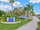 The Plantation Golf & Country Club neighborhood entrance sign, complemented by lush landscaping and trees at 22324 Wexford Blvd, Venice, FL 34293