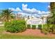 The Courtyards at Plantation neighborhood sign, complemented by lush green landscaping and a manicured lawn at 22324 Wexford Blvd, Venice, FL 34293