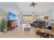 Bright and airy living space featuring tile flooring, a large sectional, ceiling fan, and a view of the outdoors at 22324 Wexford Blvd, Venice, FL 34293