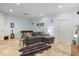 Cozy living room with a comfortable couch, and an area rug on top of tile flooring at 22324 Wexford Blvd, Venice, FL 34293