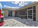 Stone patio with a screen enclosure, offering an inviting outdoor space at 22324 Wexford Blvd, Venice, FL 34293