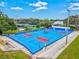 Well-maintained pickleball courts with vibrant blue and red surfaces, ready for friendly competition at 22324 Wexford Blvd, Venice, FL 34293