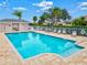 Private pool surrounded by a white fence, with lounge chairs, perfect for outdoor relaxation and enjoyment at 22324 Wexford Blvd, Venice, FL 34293