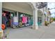 Sidewalk view of retail shops with clothing displays and storefronts at 22324 Wexford Blvd, Venice, FL 34293