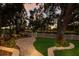 Well-manicured backyard with a stone path, fenced garden and view of the water at 2309 Chardonnay Ter, Parrish, FL 34219