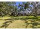 Expansive backyard with mature trees provides privacy and shade at 2309 Chardonnay Ter, Parrish, FL 34219