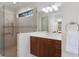 Modern bathroom featuring large vanity, tile floors, glass shower, and updated fixtures at 2309 Chardonnay Ter, Parrish, FL 34219