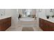 Relaxing bathroom featuring a soaking tub, dual vanities and plenty of natural light at 2309 Chardonnay Ter, Parrish, FL 34219