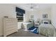 Bright bedroom featuring twin beds, a ceiling fan and lots of natural light from the window at 2309 Chardonnay Ter, Parrish, FL 34219