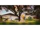 Charming home featuring lush landscaping, mature trees, and a well-maintained lawn at 2309 Chardonnay Ter, Parrish, FL 34219