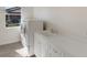 Functional laundry room with washer, dryer, sink, and ample counter space at 2309 Chardonnay Ter, Parrish, FL 34219