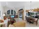 Open living space boasts large windows offering pool views, with a breakfast nook and comfortable furnishings at 2309 Chardonnay Ter, Parrish, FL 34219