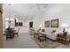 Comfortable living room area with tile flooring, rug, and adjacent dining area at 2309 Chardonnay Ter, Parrish, FL 34219