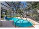 Gorgeous screened-in pool and patio area with access to the beautiful lake at 2309 Chardonnay Ter, Parrish, FL 34219