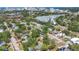 Expansive aerial view showcasing residential area surrounded by mature trees, near waterfront at 2350 Novus St, Sarasota, FL 34237