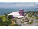 Aerial view of a purple building with a white tent with palm trees and a roundabout at 2350 Novus St, Sarasota, FL 34237
