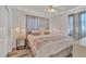 Cozy bedroom featuring a comfortable bed, soft lighting, and neutral decor at 2350 Novus St, Sarasota, FL 34237