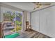 Bedroom with a sliding glass door to patio and large closet with ceiling fan at 2350 Novus St, Sarasota, FL 34237