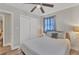 Well-lit bedroom featuring a ceiling fan, neutral colors, and spacious closet at 2350 Novus St, Sarasota, FL 34237