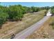 Picturesque aerial view of a bike path winding through a lush green landscape, promoting an active lifestyle at 2350 Novus St, Sarasota, FL 34237