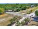 Inviting pathway with street sign, lined with palm trees, offers a picturesque entrance to the community at 2350 Novus St, Sarasota, FL 34237