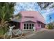 Charming Sarasota Film Society building with a pink facade and an inviting entrance at 2350 Novus St, Sarasota, FL 34237