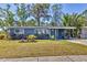 Charming home featuring well-manicured lawn and covered front porch at 2350 Novus St, Sarasota, FL 34237