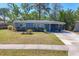 Well-maintained home with inviting front yard and covered entry porch at 2350 Novus St, Sarasota, FL 34237