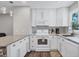 Modern kitchen featuring white cabinets and stainless appliances at 2350 Novus St, Sarasota, FL 34237
