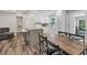 View of kitchen and dining area with eat-in island and stainless appliances at 2350 Novus St, Sarasota, FL 34237