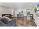 Open concept living area featuring modern flooring, kitchen, and dining space at 2350 Novus St, Sarasota, FL 34237