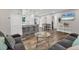 Spacious open-concept living and dining area with seamless flow to the kitchen at 2350 Novus St, Sarasota, FL 34237