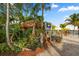 Charming tiki bar with lush tropical landscaping and waterfront views at 2350 Novus St, Sarasota, FL 34237