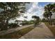 Scenic park pathway with benches, palm trees, and views of the waterfront at 2350 Novus St, Sarasota, FL 34237