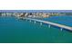 Stunning aerial view of a scenic bridge leading to a vibrant cityscape along a picturesque coastline at 3004 Bay Shore Cir, Sarasota, FL 34234