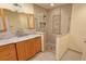 Updated bathroom features vanity with granite countertops and walk-in shower at 3004 Bay Shore Cir, Sarasota, FL 34234