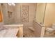 Updated bathroom features walk-in shower with beautiful tile at 3004 Bay Shore Cir, Sarasota, FL 34234