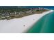 Expansive aerial view of Siesta Key beach with soft white sand and clear turquoise waters at 3004 Bay Shore Cir, Sarasota, FL 34234